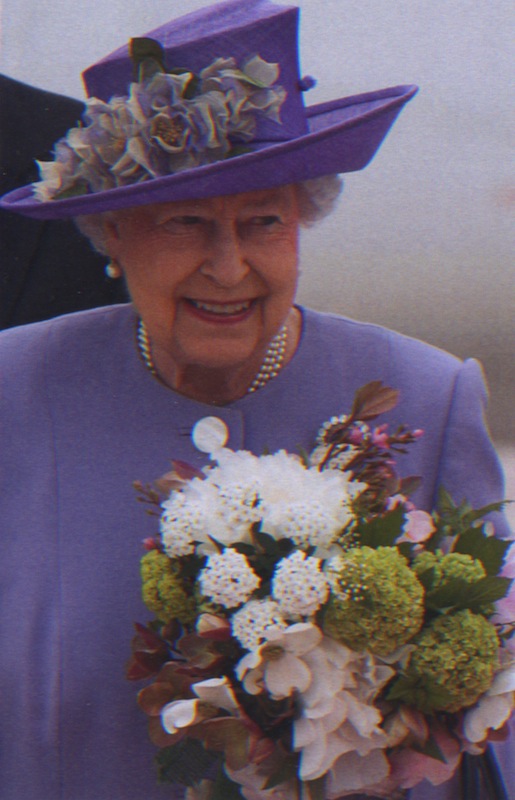 Her Majesty The Queen in Rome on 3April 2014 with flowers from the Villa Wolkonsky Gardens.